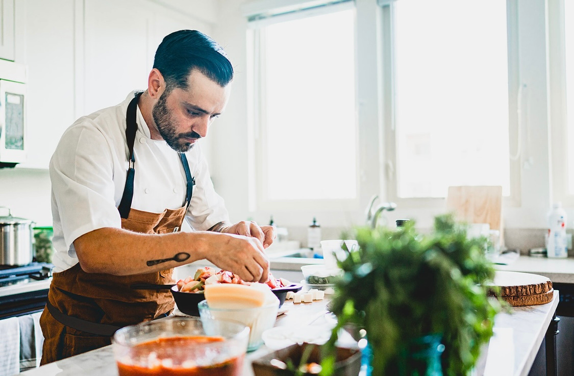 Chef Justin Campbell preparing a private dining experience