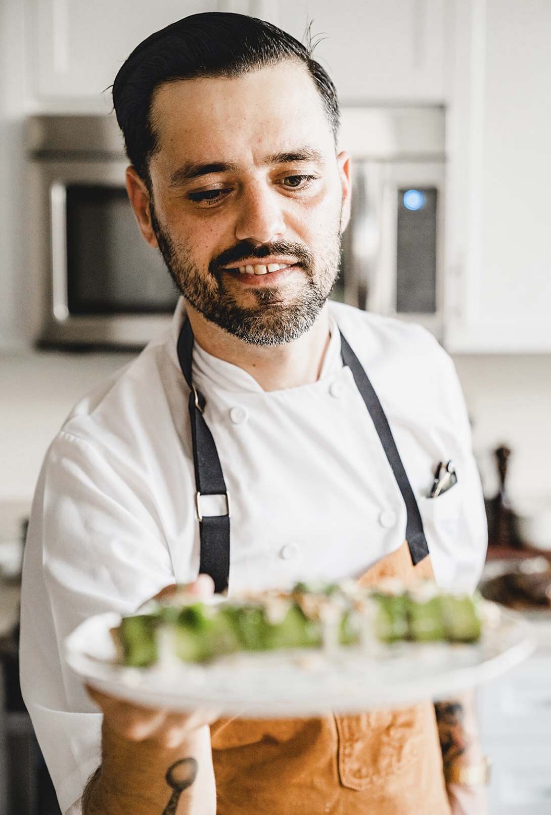 Chef Justin Campbell presenting a private dining course